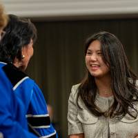 on stage with president